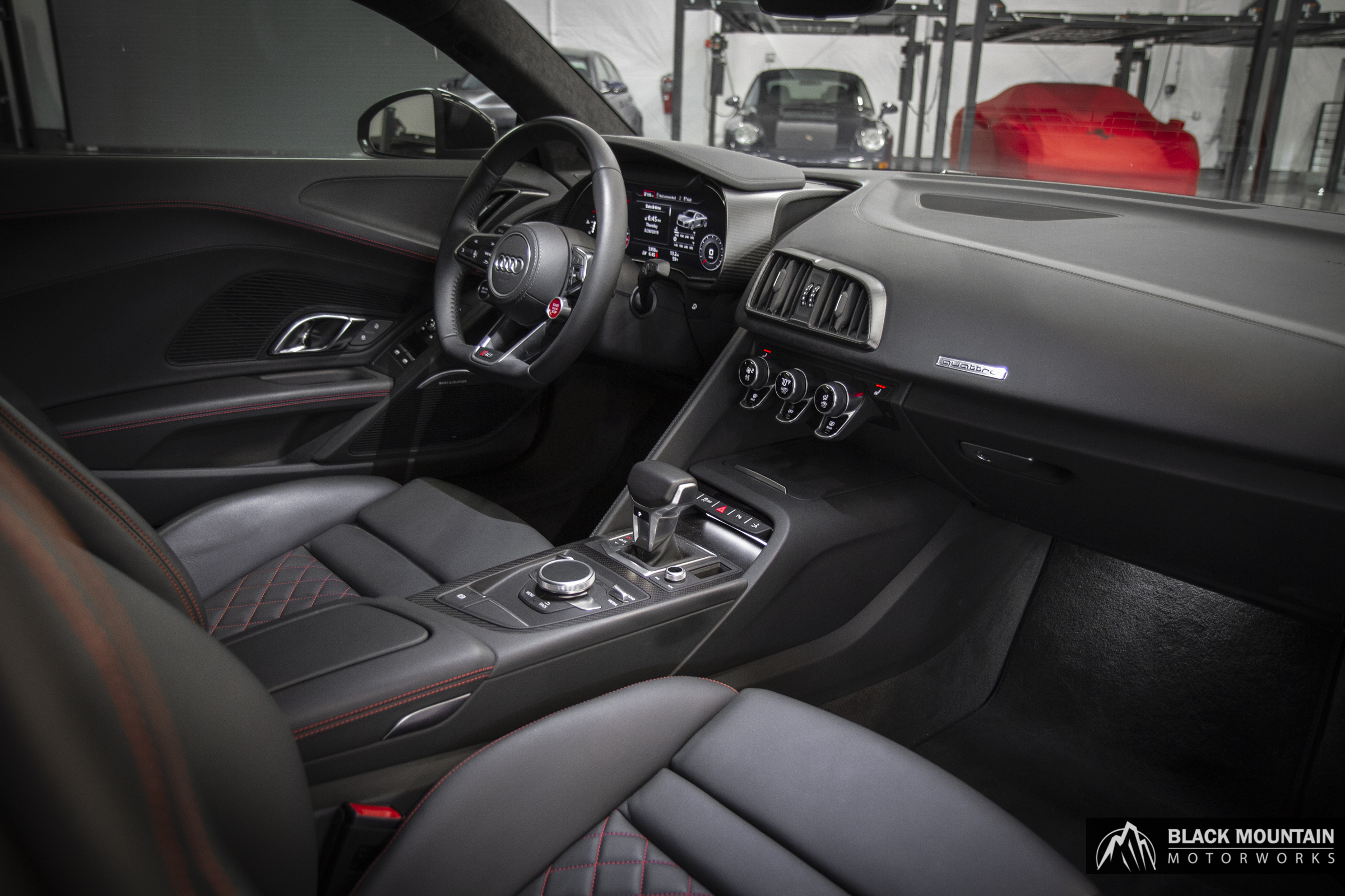 Luxury car interior being professionally detailed